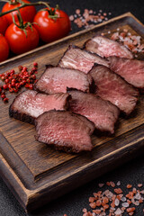 Grilled beef steak meat with salt and pepper. Beef steak grilled on a barbecue