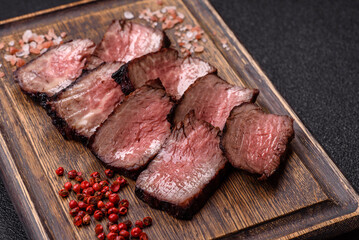 Grilled beef steak meat with salt and pepper. Beef steak grilled on a barbecue