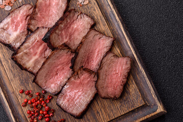 Grilled beef steak meat with salt and pepper. Beef steak grilled on a barbecue