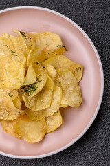 Crisps fried with salt, spices and garlic. Cooked potatoes