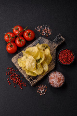 Crisps fried with salt, spices and garlic. Cooked potatoes