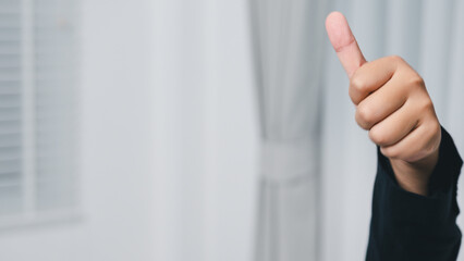 Celebrating success with a thumbs up gesture a bright indoor environment for positive vibes