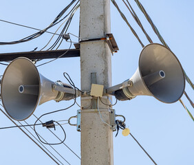 Public address system loudspeakers on a pole