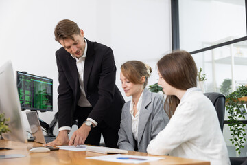 Colleagues collaborating on a project in a modern office