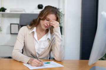 Caucasian businesswoman grab his head suffer from headache