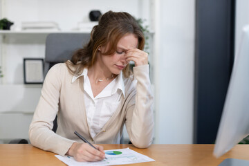 Caucasian businesswoman grab his head suffer from headache