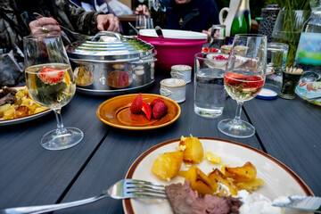 Dining at party, food, strawberry and sect.
