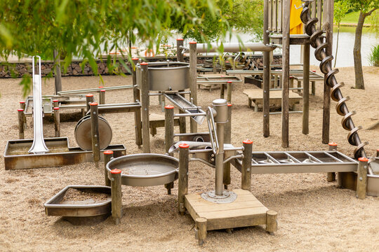 This engaging water play structure features various channels, slides, and water features designed for children's interactive play