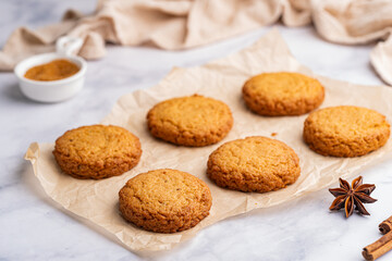 Homemade peanut or almond butter cookies or oatmeal cookies on white kitchen background. High quality photo