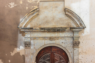 Architrave of the side entrance in the Church of the Holy Sepulchre. Cagliari, Sardinia, Italy
