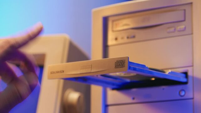 Using CD circle disk for old computer. Dvd player, disc drive. Music recorder, playing retro computer games. 