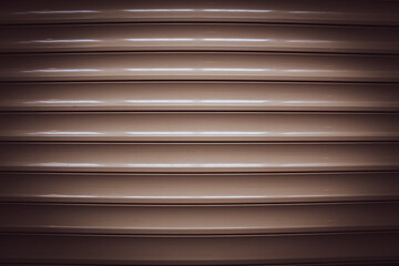 long glossy brown panels on the wall, parallel lines