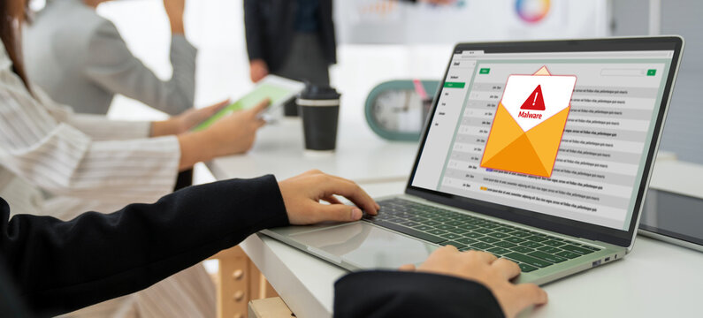 Cyber attacking concept. Malware alert showing on computer screen display scam and threat detection on computer system or online server to be removed snugly.
