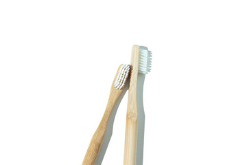 Two wooden toothbrushes on a white background for eco-friendly oral care