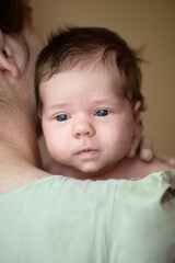 Tender Moment Between Mother and Newborn Baby