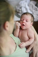 Peaceful Sleeping Newborn Baby with Pacifier on White Bed