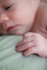 Peaceful Sleeping Newborn Baby with Pacifier on White Bed