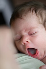 Peaceful Sleeping Newborn Baby with Pacifier on White Bed