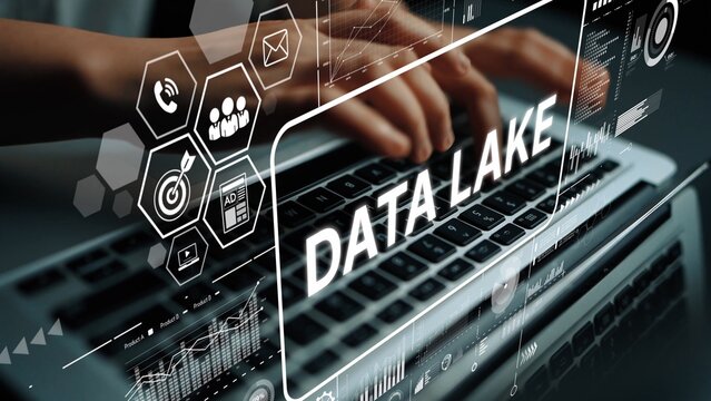Technology concept showing hands typing on laptop with data visualization and analytics themes including Data Lake concept. Asymptotic smart data analytic.