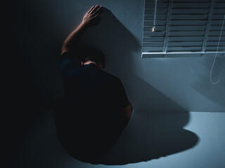 Depression and pain a man's emotional struggle a dim room capturing health challenges