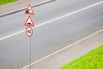 road sign warning of exit to embankment. danger to life while driving a car. risk of getting into a car accident. place for inscription
