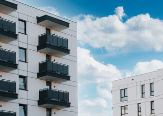 Modern apartment building with balconies against blue sky