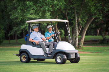Young man driving golf cart while chatting happily with senior golfer. Golf Cart Ride, Outdoor Golf, Summer Activity. © DJ Creative Studio