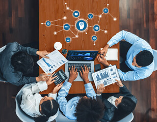 A dynamic team engages in data analysis and strategy development in a contemporary office...