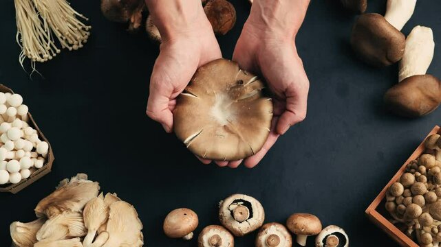Fresh Royal oyster mushrooms, chef cooking on a wooden cutting board with knife in cafe asian restaurant kitchen, vibrant scene of food preparation
