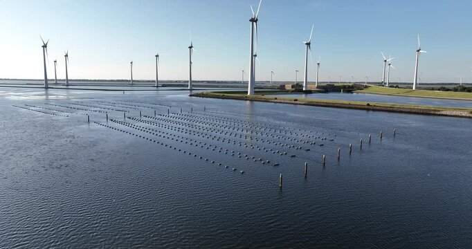 fishing nets, fish traps, modern fishery at the KRammersluices, Zeeland, The Netherlands. Sluice and lock complex. Aerial view. WInd turbines.