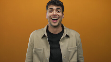 Obraz premium Man hands clap on backdrop while young hispanic male smile happy applaud.