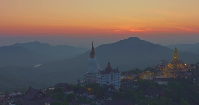
Aerial view beautiful golden pavilion at Wat Phachonkeaw at sunrise.
5 sitting buddha statues of Phachonkeaw on Khao Kho hill the beautiful landmark 
and famous in Phetchabun Thailand