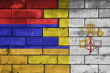 colourful painted big national flag of vatican city and flag of armenia on a massive old brick wall background. concept