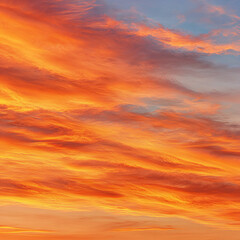 Fototapeta premium Vibrant sunset colors paint the sky with shades of orange, pink, and blue over a calm horizon during evening hours