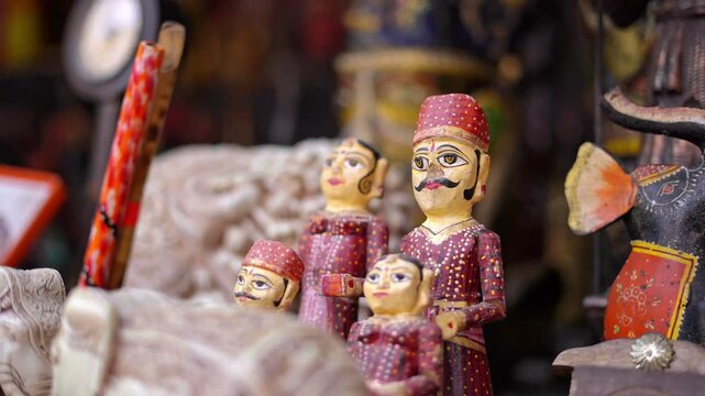 Traditional Kathputli puppets from Rajasthan, India, displayed together with a close-up of a male puppet, featuring vibrant colors, intricate details, and cultural artistry