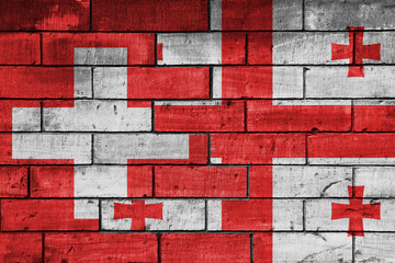 colourful painted big national flag of georgia and flag of switzerland on a massive old brick wall background. concept