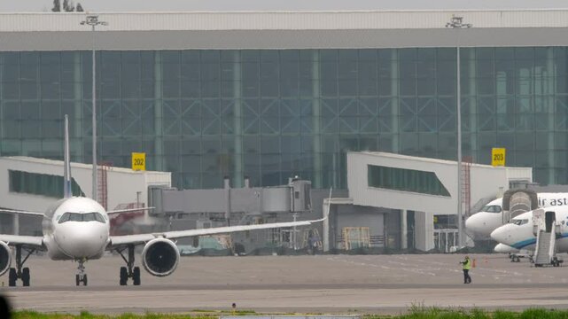 ALMATY, KAZAKHSTAN - MAY 12, 2024: Passenger plane Airbus A321 of Air Astana taxiing. Airliner on the taxiway. Travel concept