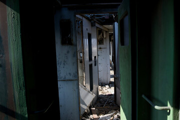 Interior of Abandoned Train Car with Sunlight and Debris