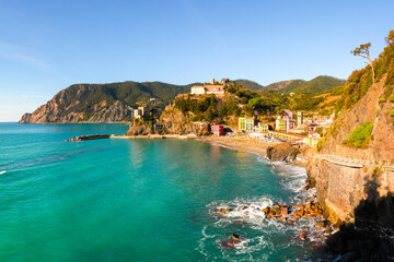 Picturesque Monterosso al Mare in Cinque Terre, Liguria, Italy bathed in bright summer sun. Ligurian sea in summer time. Landscape photography