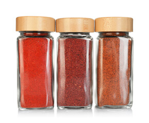 Many different aromatic spices in jars isolated on white