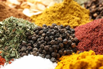 Many different spices as background, closeup view