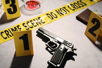Forensic expertise. Crime scene with evidence, markers and police tape on light grey background,...