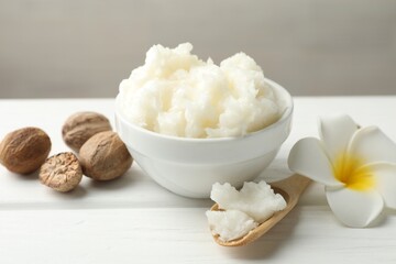 Natural shea butter on white wooden table, closeup