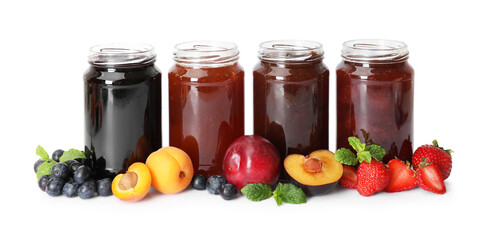 Different jams in jars and ingredients isolated on white