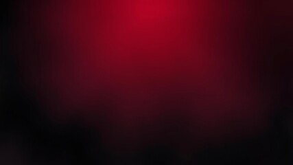 A dark and dramatic red and black gradient illustrating a feather or wing silhouette