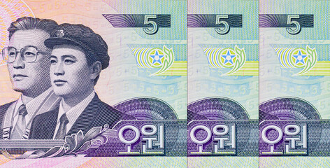 5 Won North Korea Banknote 2002 with atomic symbol and party members. Paper money of North Korea.