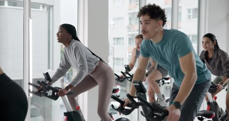 Class, indoor cycling and people exercise for fitness, burn calories and lose weight for body health. Gym, group and stationary bike for cardio training, workout and leg strength for muscle wellness - Powered by Adobe