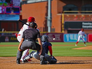 batter hitting and catcher
