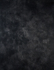 Dark charcoal-gray textured backdrop with slight grunge, moody studio studio portrait setting 2