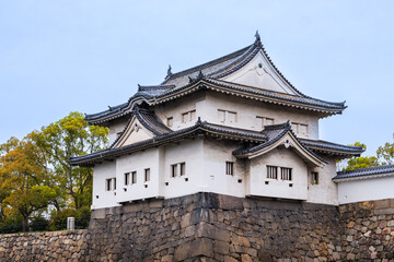 Osaka Castle with the beautiful lake surrounding it during Spring and the cherry blossoms , Osaka, Japan, South East Asia.